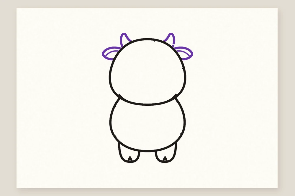 Dessin de vache simple pour enfant : deux petites cornes et deux oreilles